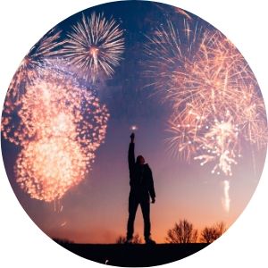 Person Standing in the Open with Fireworks in the Background