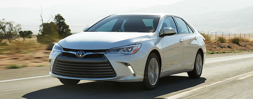 What’s New for the 2016 Toyota Camry? at Allan Nott-Lima OH-Fort Wayne IN-New Toyota and Honda Dealer-2016 Toyota Camry White Exterior on Country Road
