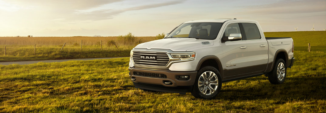 white ram 1500 in grass field