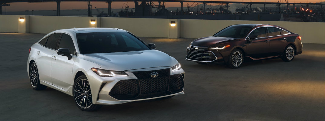 Two 2019 Toyota Avalon Parked Near Each Other in a Parking Lot