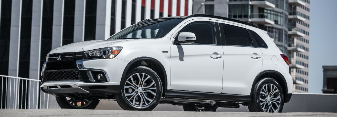 side view of a white 2018 Mitsubishi Outlander Sport
