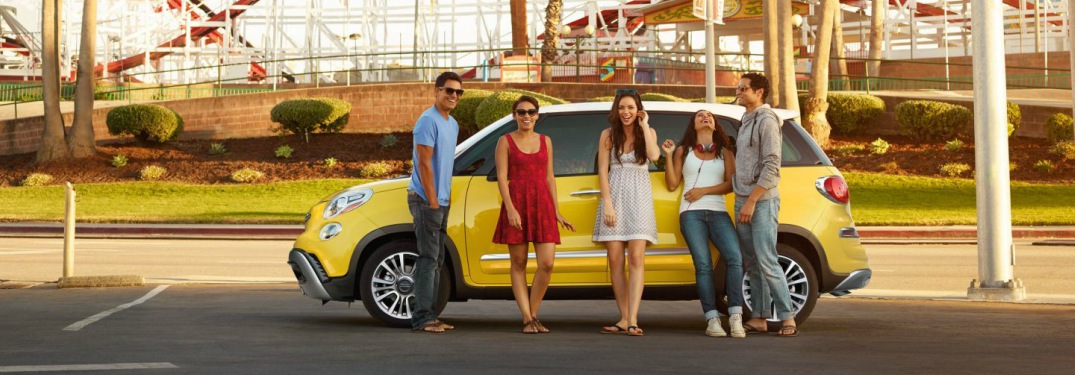 2018 FIAT 500L yellow side view with people