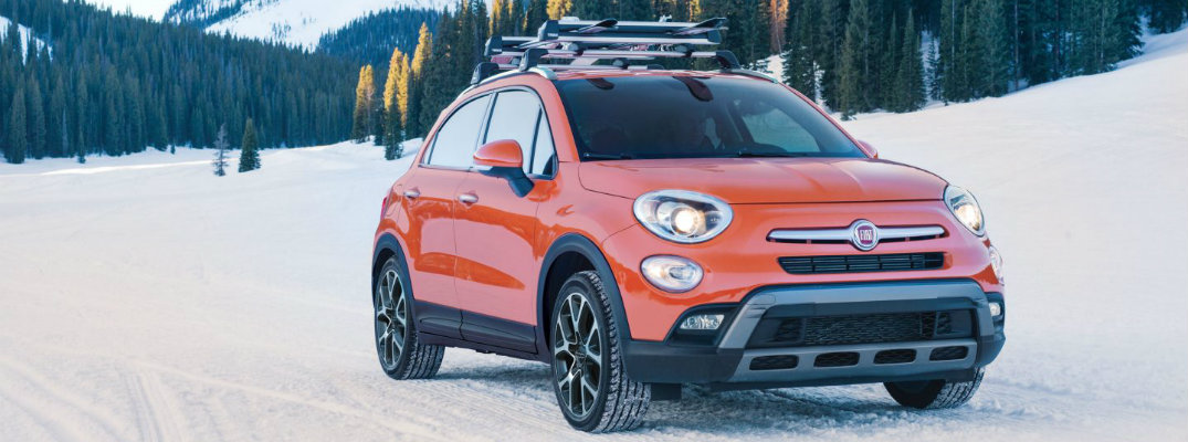 Exterior shot of 2017 Fiat 500x driving on snowy terrain