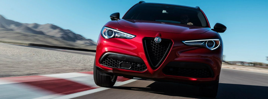 Front view of red 2018 Alfa Romeo Stelvio on track