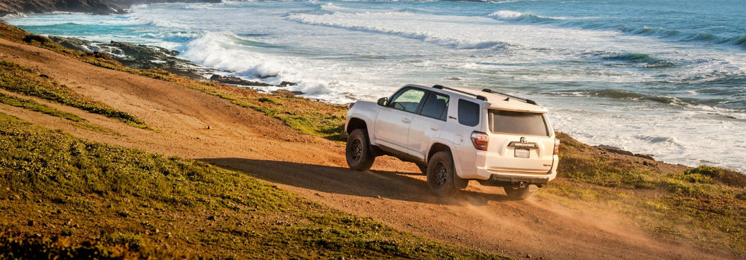 Driver side exterior view of a white 2018 Toyota 4Runner