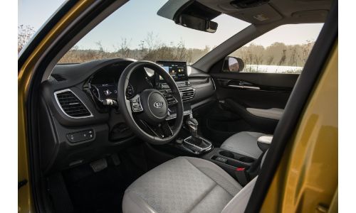 2021 Kia Seltos interior shot of driver's seat, steering wheel, and dashboard design and layout