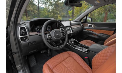 2021 Kia Sorento interior shot of front seating, steering wheel, and dashboard layout