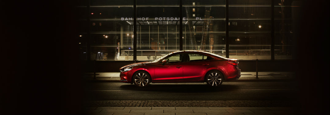 Driver side exterior view of a red 2018 Mazda6
