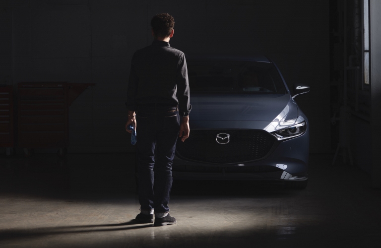 2021 Mazda3 gray front view mostly obscured by darkness