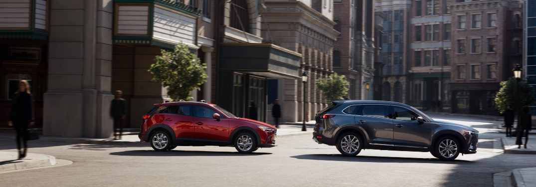 side view of two 2021 Mazda CX-3 SUVs
