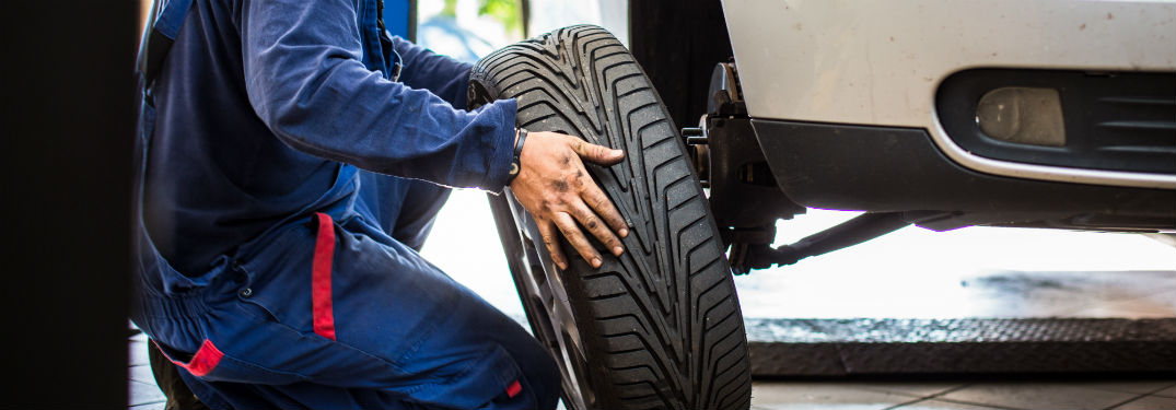 service tech changing a tire