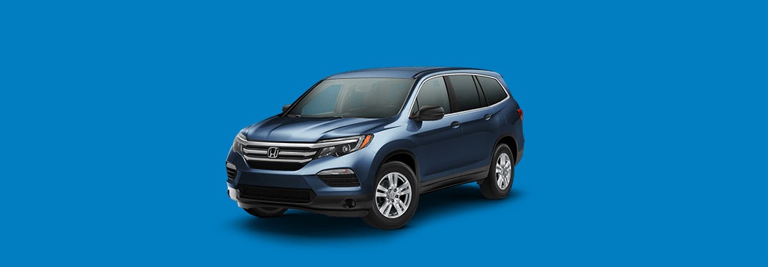 2018 Honda Pilot LX Exterior Front Fascia and drivers side with blue background