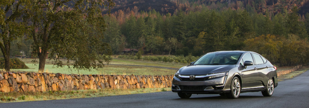 2018 Honda Clarity Plug-Hybrid front and drivers side on country road and trees