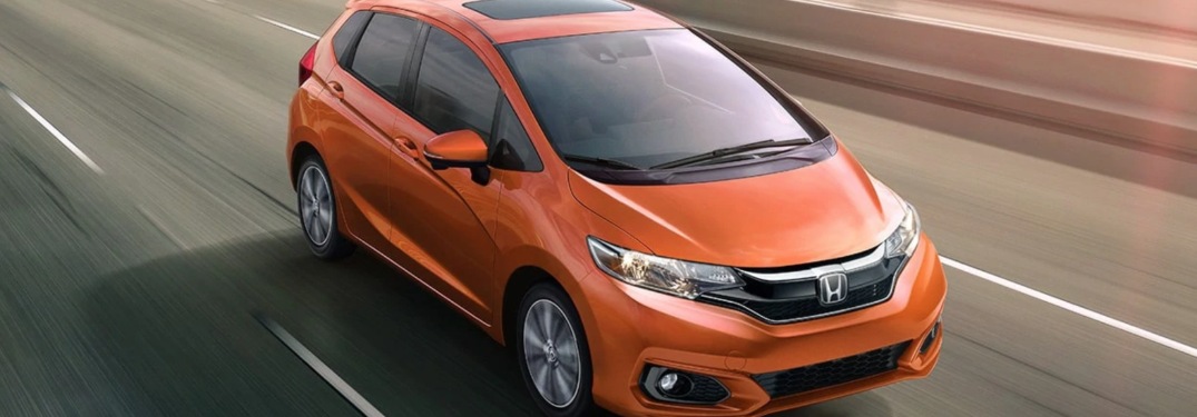 2019 Honda Fit driving down a highway