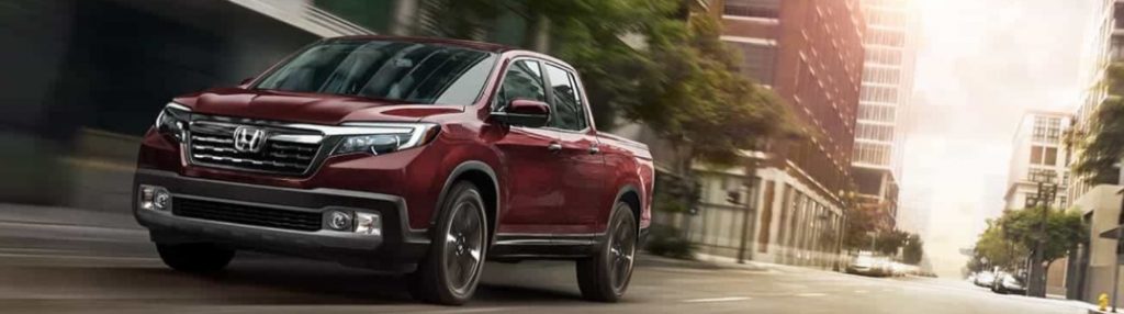 2020 Honda Ridgeline driving down a city street