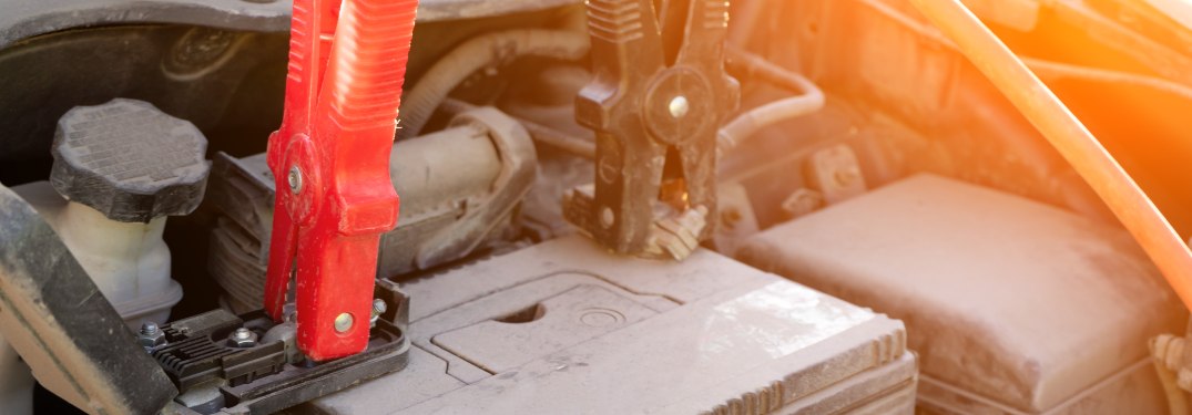 Car battery with jumper cables attached
