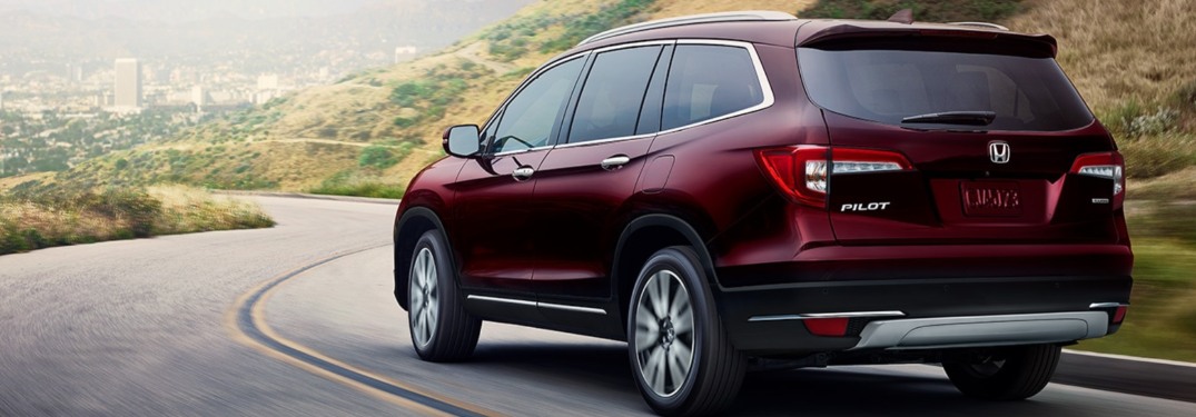 2021 Honda Pilot driving down a winding road
