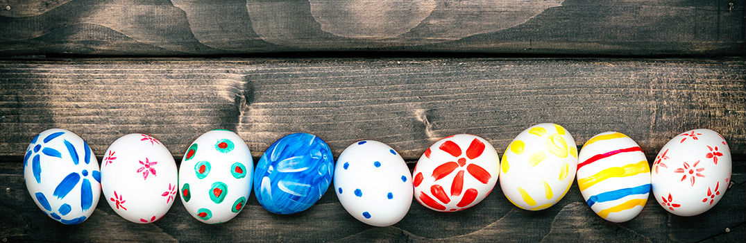 Colored Easter Eggs on Wooden Table