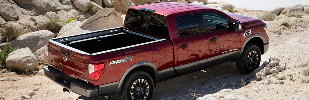 2018 Nissan Titan XD driving on rocks