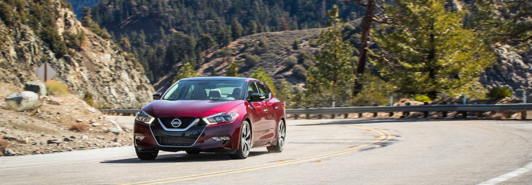 red nissan altima on country road