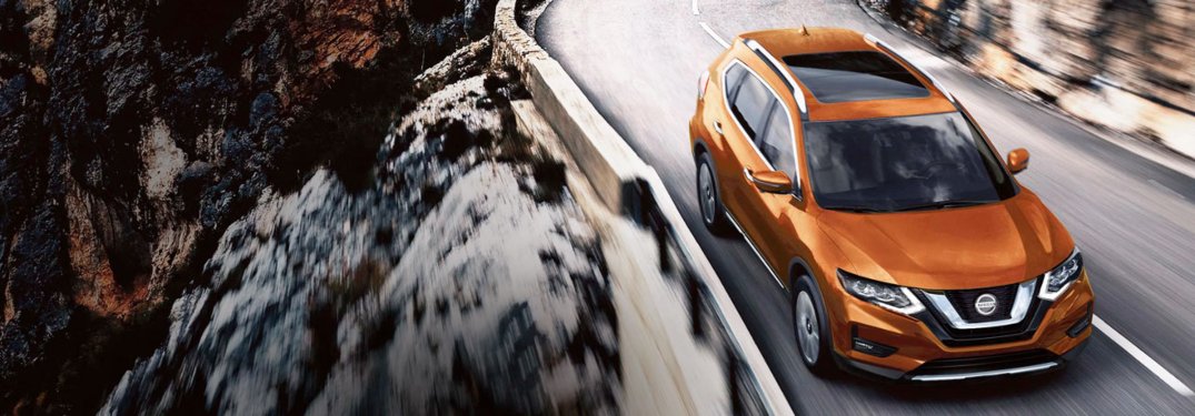 2020 Nissan Rogue driving in a mountain