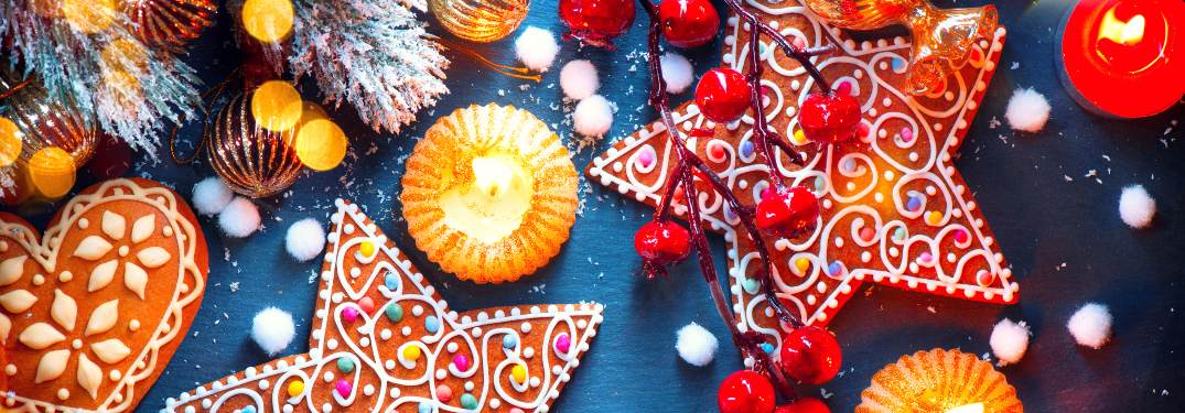 A wide spread of Christmas decorations and treats on a table