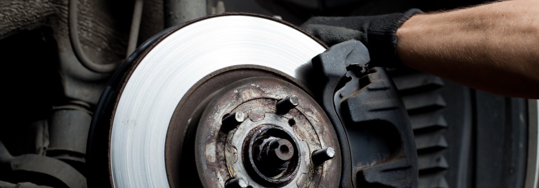 A mechanic working on a brake