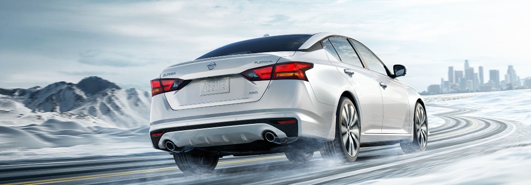 2020 Nissan Altima driving down an icy highway road