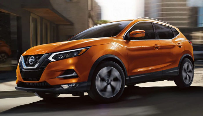 2020 Nissan Rogue Sport driving down a city street