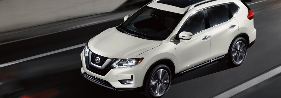 2020 Nissan Rogue driving fast down a paved road