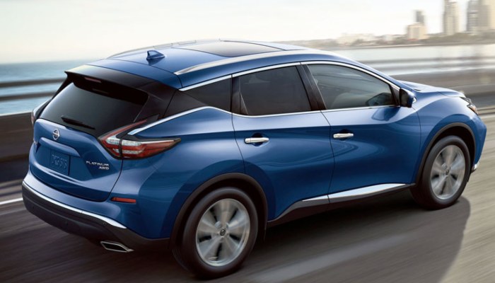 2020 Nissan Rogue driving over a bridge
