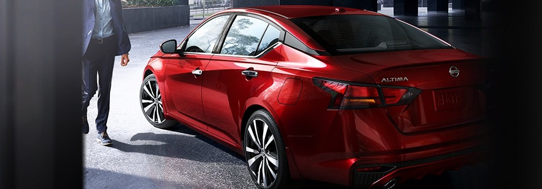 A man entering a 2021 Nissan Altima