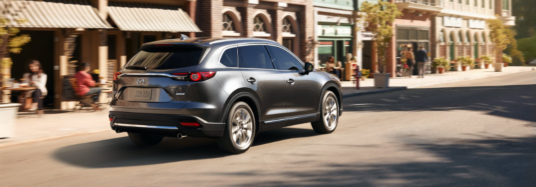 Rear-view-of-2018-Mazda-CX-9-driving-through-town