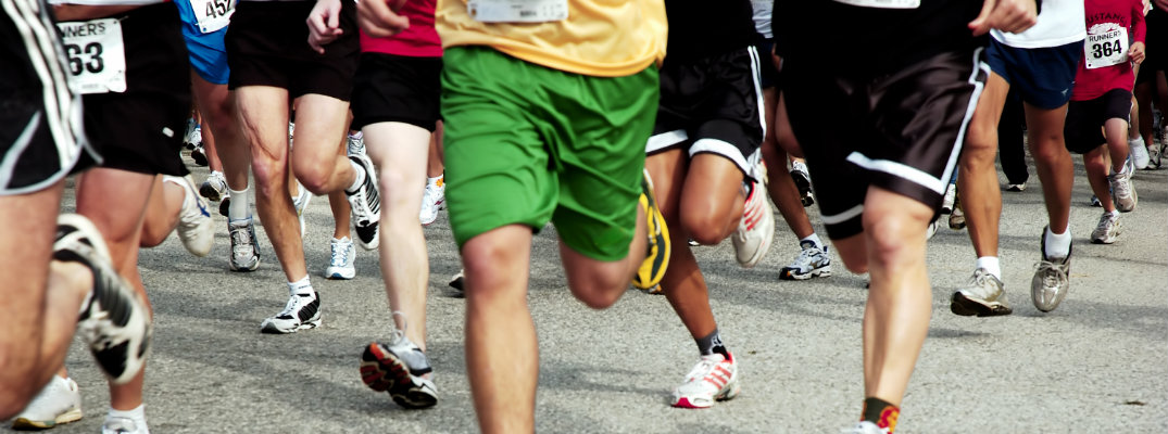 Group of men and women competing in a race