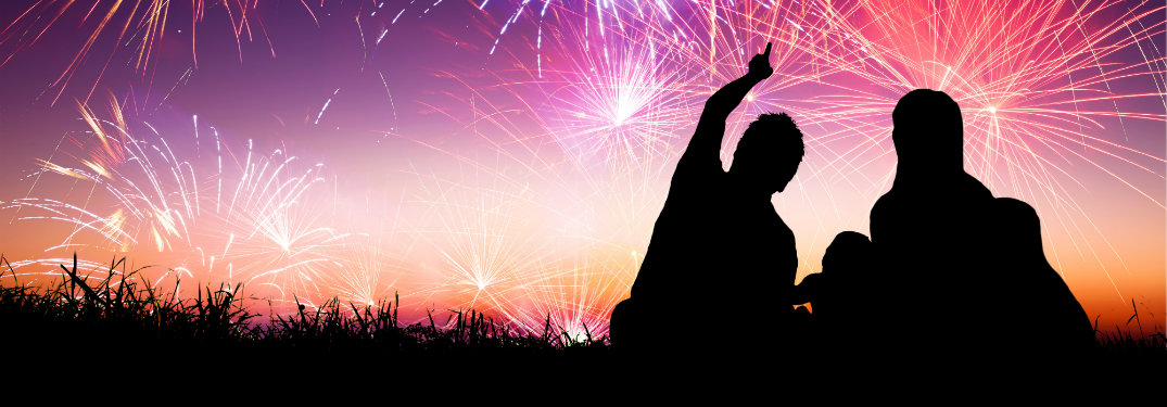 family looking at fireworks