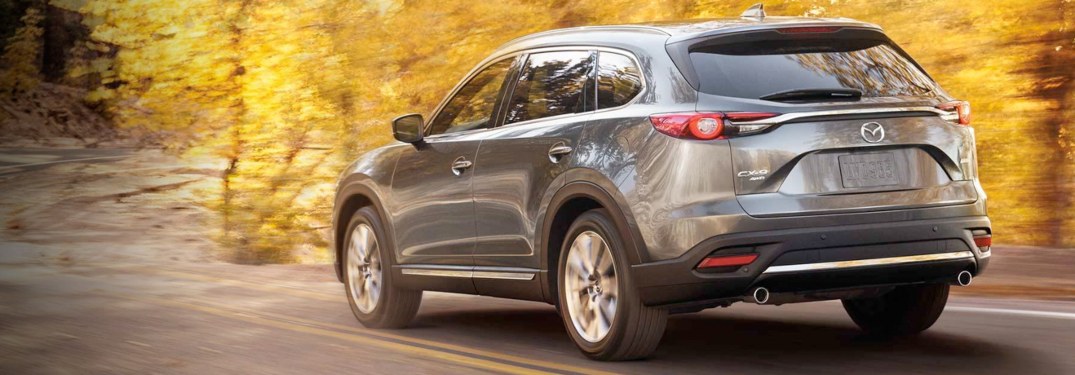 2019 Mazda CX-9 driving down a rural road
