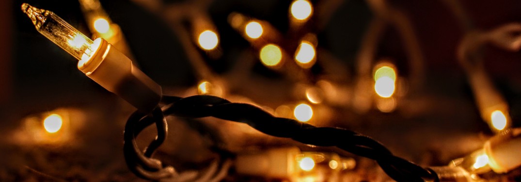 A set of holiday lights glowing in the dark