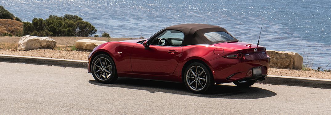 2019 Mazda MX-5 Miata driving on a beachside road