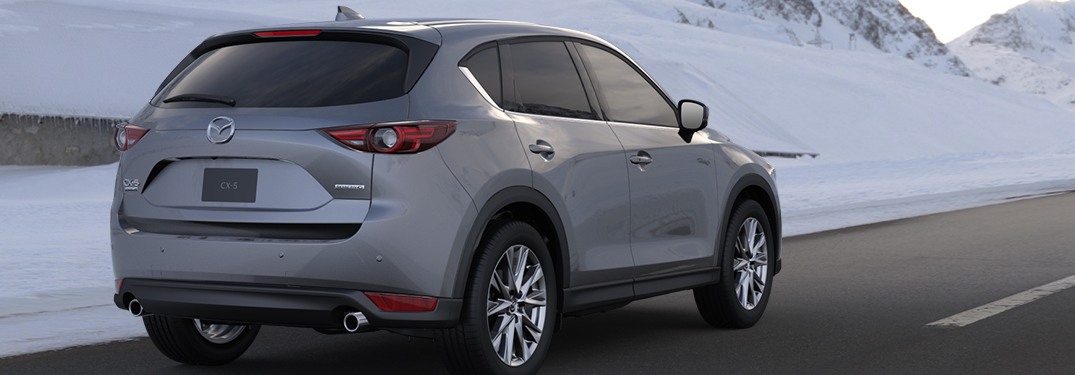 2020 Mazda CX-5 driving down a rural highway road