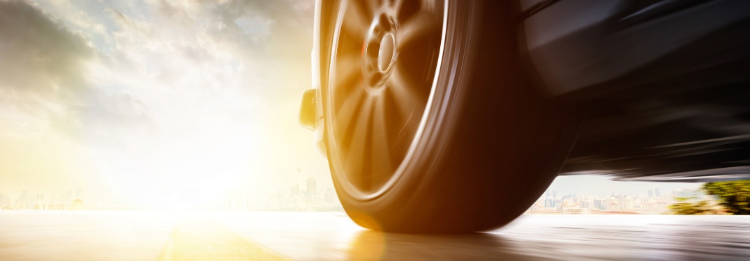 Low angle view of a car's tire on a sunny day