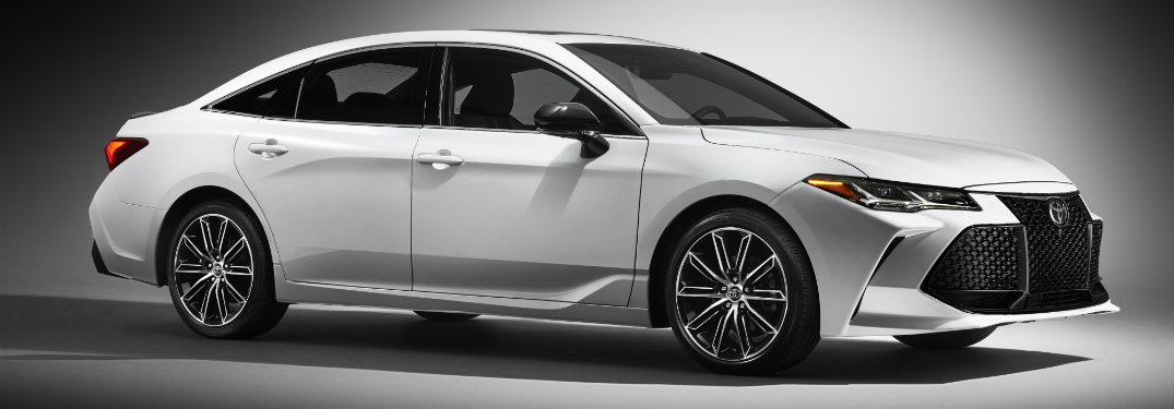 white 2019 toyota avalon against white background with shadows