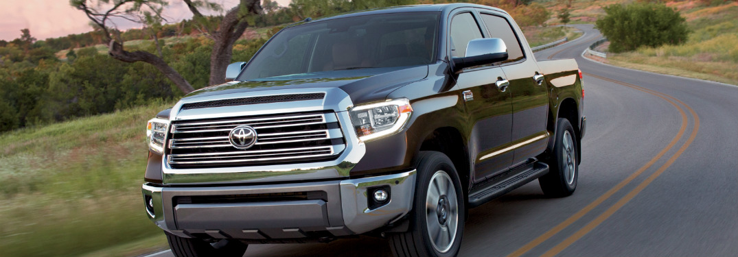 black 2018 toyota tundra driving on country road