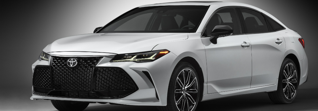 white 2019 toyota avalon against black background