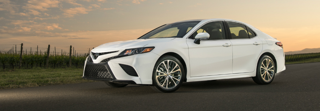 front and side view of white 2018 toyota camry