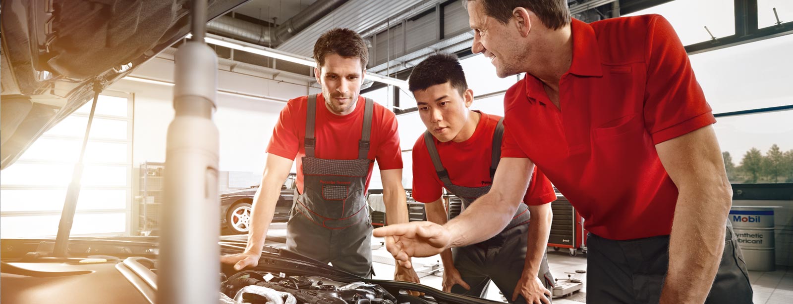 mechanics fixing car
