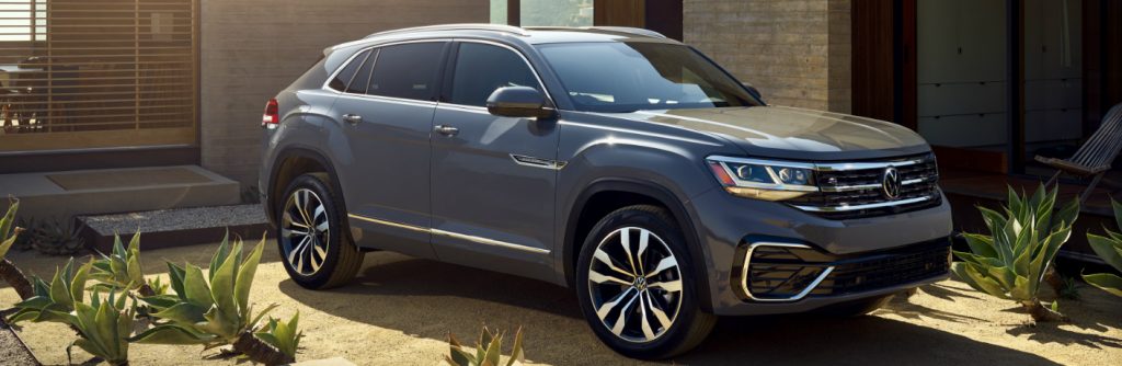 Grey 2020 Volkswagen Atlas Cross Sport parked in front of a house