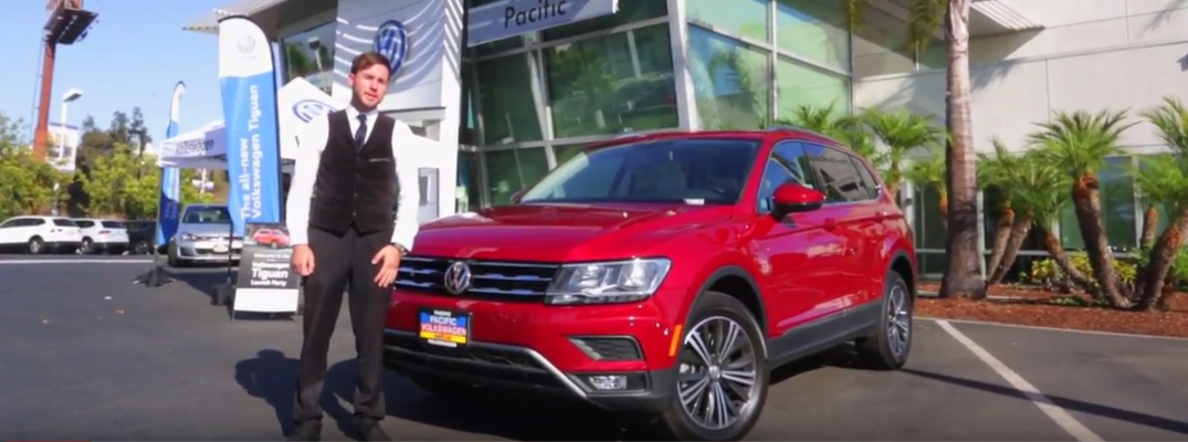 Man at Pacific Volkswagen Standing next to a Red 2018 VW Tiguan
