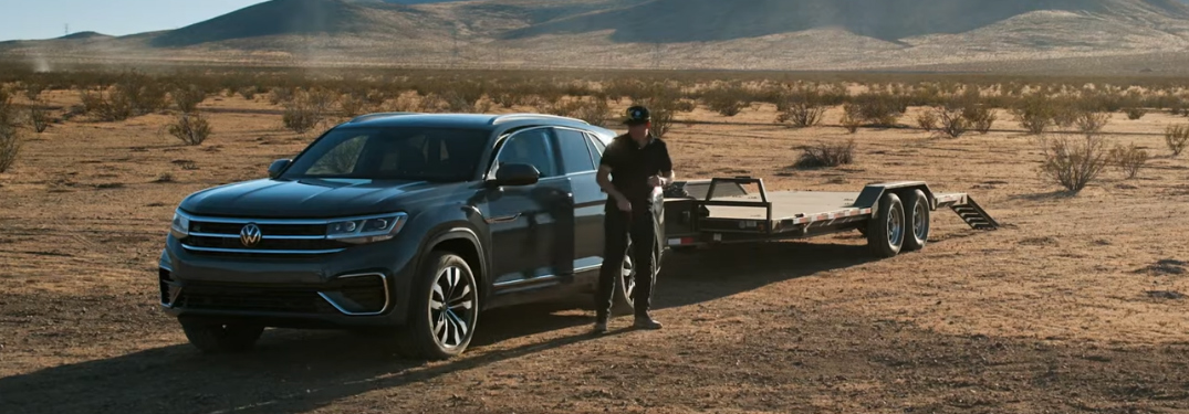 Tanner Foust polishing a 2020 Volkswagen Atlas Cross Sport in the desert