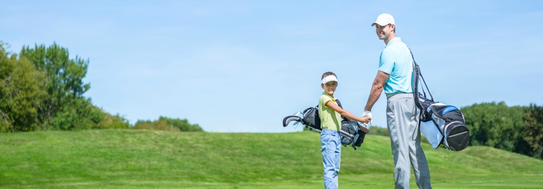 dad and son playing golf