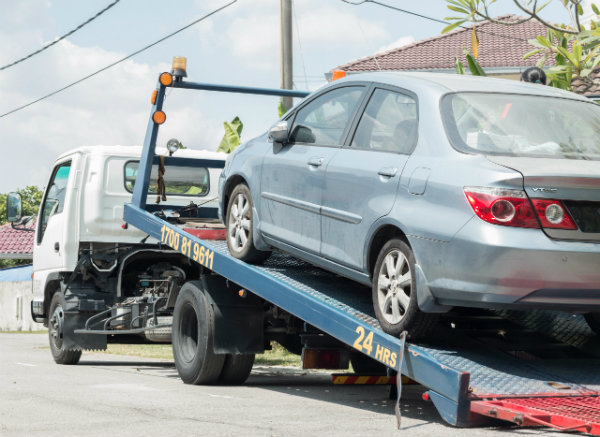 1990s car on flatbed